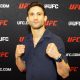 De punhos cerrados, Allan Puro Osso posa para foto durante o media day do UFC 107